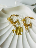 Golden earings with pearl